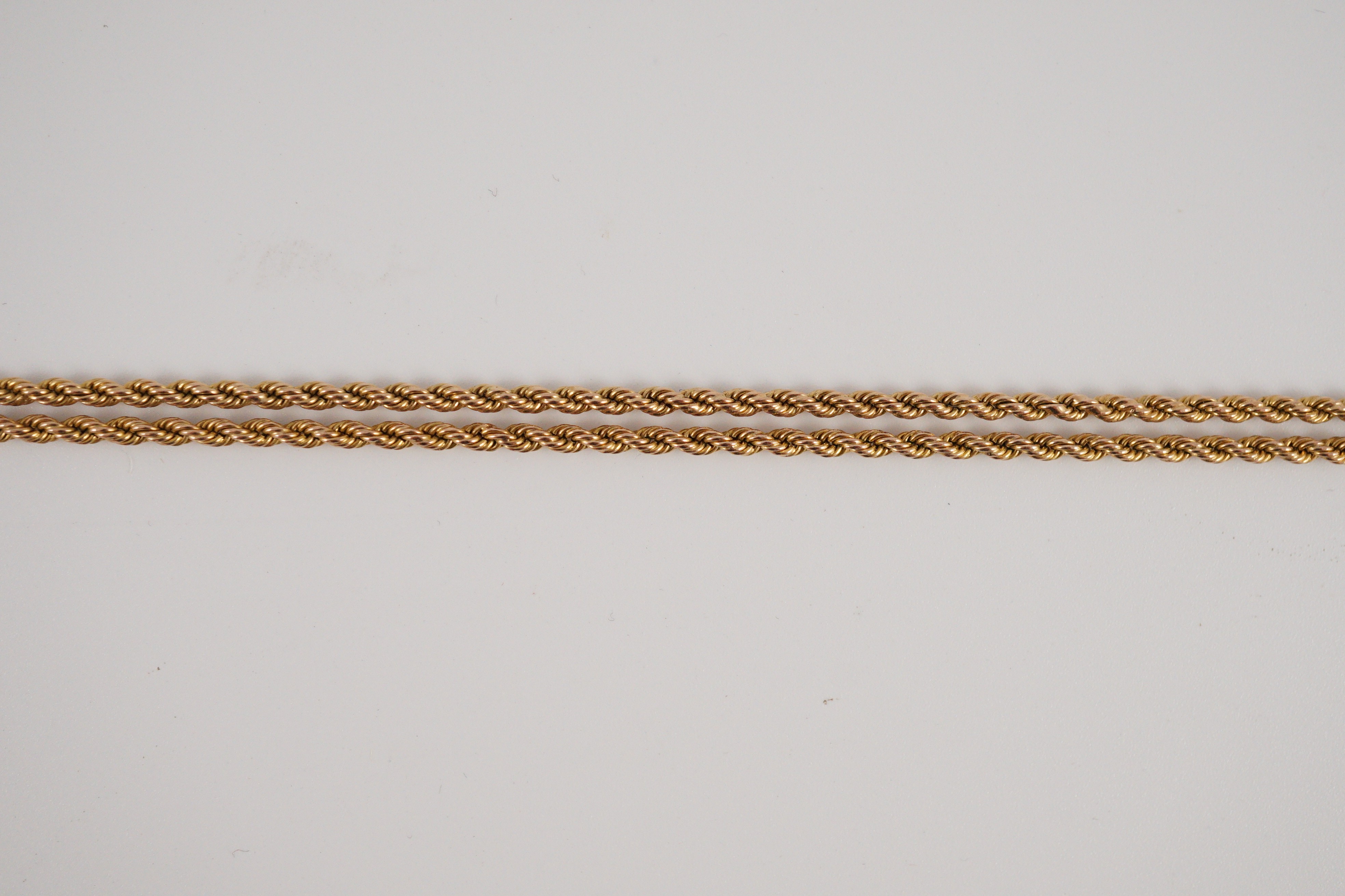 An early 20th century 15ct gold rope twist guard chain